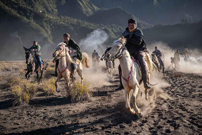 The Ride A group of Tengger horsemen riding at the foot of the Bromo volcano Buy Print