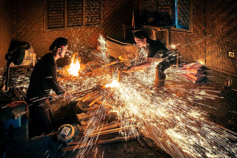 The Keris Blacksmith at work on a keris, traditional dagger dating back to the 9th century © Roberto Pazzi