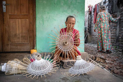 One By One Portrait of an elderly woman crafting traditional Javanese umbrellas © Roberto Pazzi