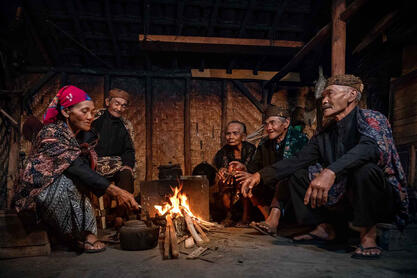 The Kitchen Group of elderly Tengger people gathered around the fire © Roberto Pazzi