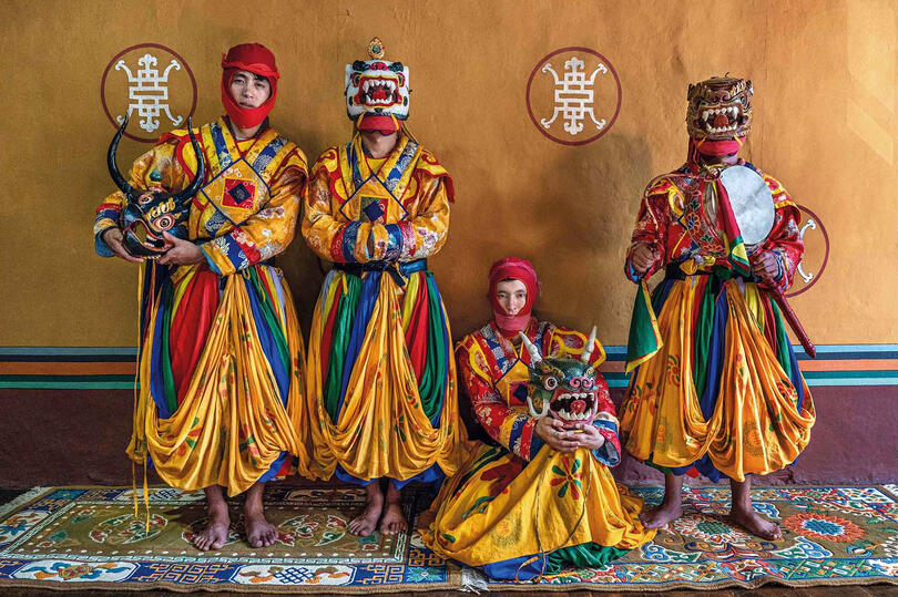 Tshechu Dancers Perfomers for the Tshechu, also known as the mask dance festival Buy Print