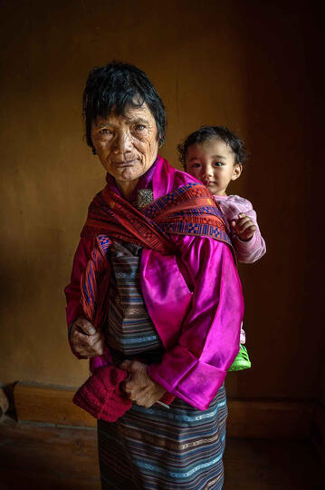 Generations Portrait of a grandmother with her young granddaughter Buy Print