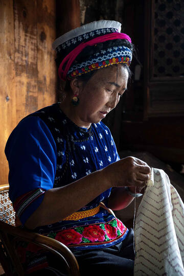 Batik Tradition Portrait of a Bai woman working on the traditional batik © Roberto Pazzi