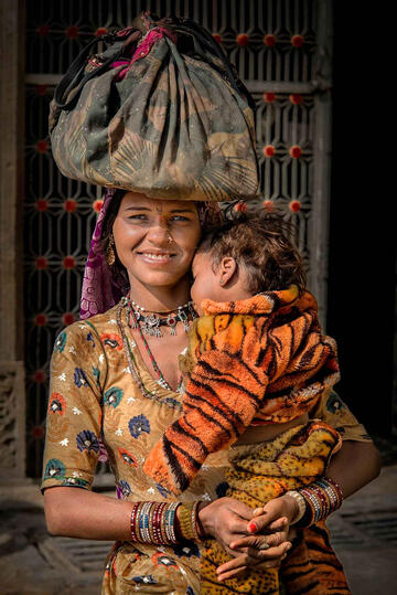 The Young Mother Portrait of young woman with her baby © Roberto Pazzi