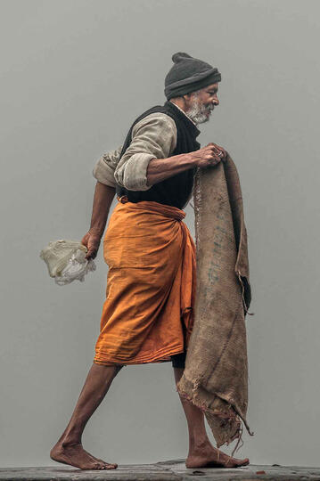 Walking in the Fog Street scene in a foggy Varanasi Buy Print