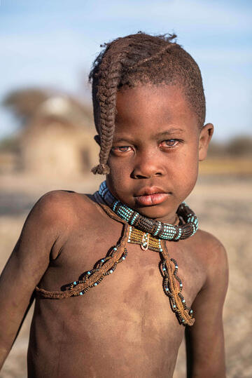 Himba Child Portrait of a Himba child with the traditional male hairstyle © Roberto Pazzi
