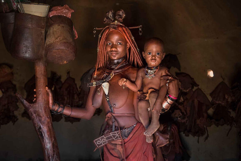 Himba Mother Portrait of a Himba woman with her baby Buy Print