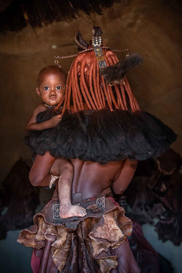 In My Mother's Arms Portrait of a Himba baby with his mother Buy Print