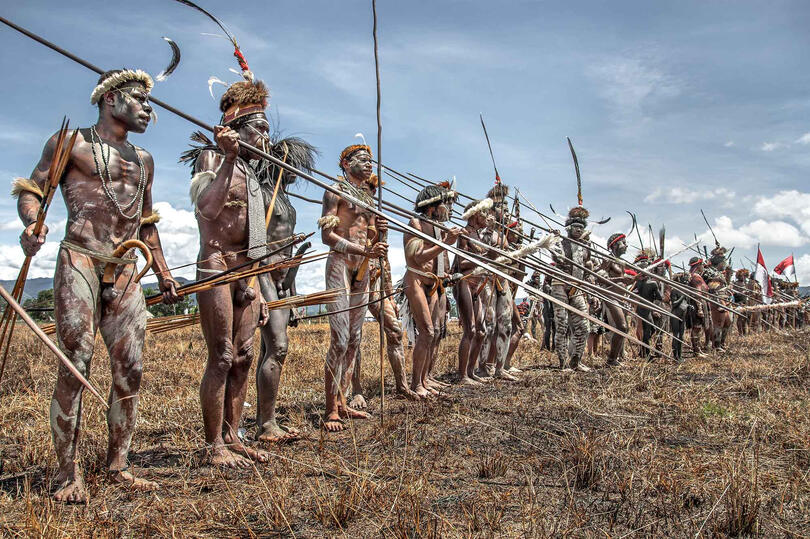 The Army Array of Dani warriors in a parade Buy Print
