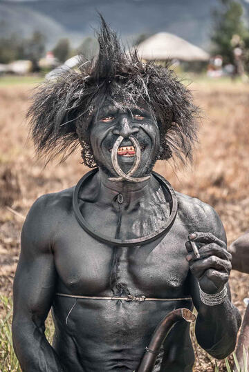 Tribal Smile Portrait of a smiling Dani leader Buy Print