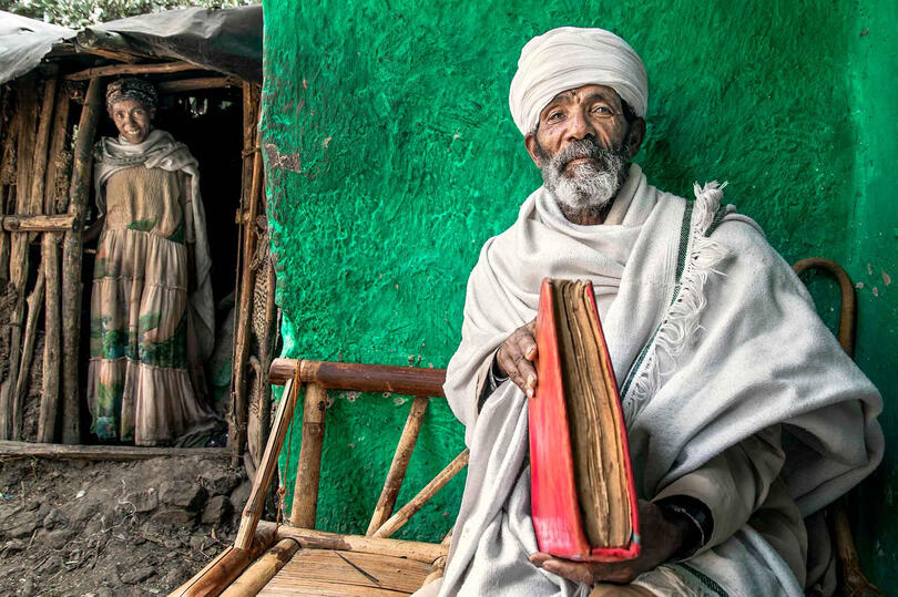 The Priest and the Book Portrait of an Orthodox priest with a holy book Buy Print