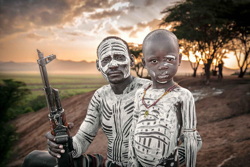 Rifle and Son Portrait of a Kara tribesman with his child Buy Print