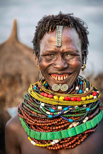 Neckleces and Smile Portrait of a Nyangatom woman © Roberto Pazzi