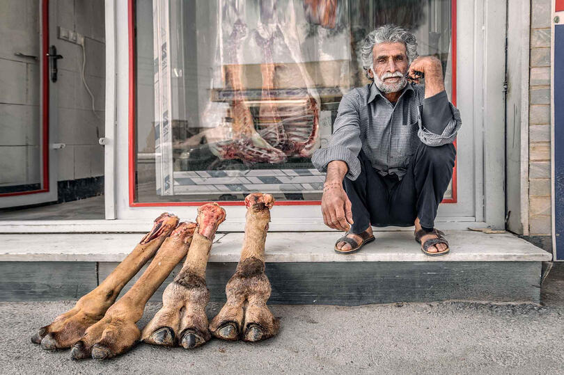 The Butcher Portrait of a butcher in front of his shop Buy Print
