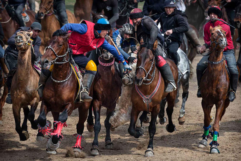Kupkari The Kupkari, the traditional Central Asian sport in which horse-mounted players attempt to place a goat carcass in a goal © Roberto Pazzi