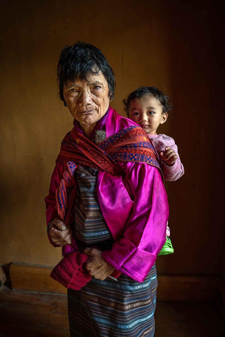 Generations Through affection, guidance, and shared moments, elders in Bhutan serve as bridges between generations, preserving cultural memory and passing on values and traditions. © Roberto Pazzi
